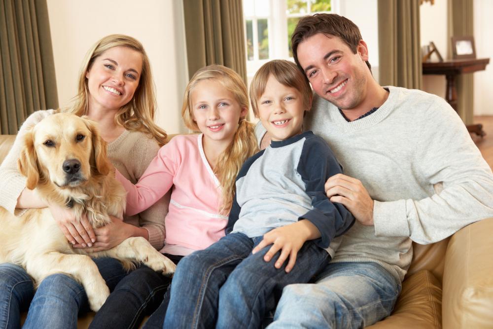 Family happy that their dog is healthy.
